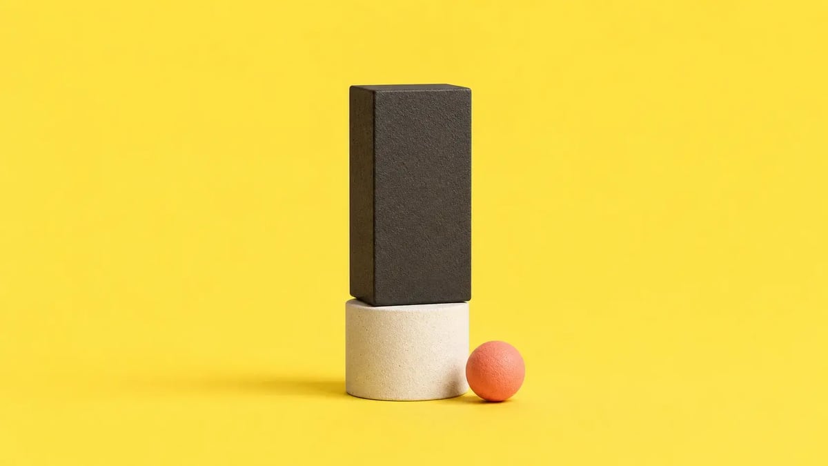 Here's why and how CFOs must redesign finance processes with agentic AI at the center. Image of a cylinder and a tall block next to a small sphere on a yellow background.